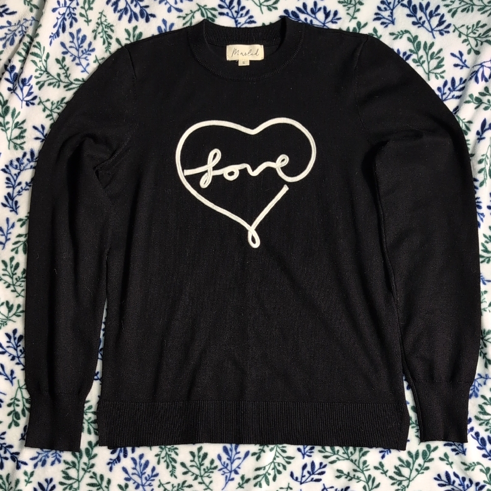 Marled Black Sweater with White Heart Design
